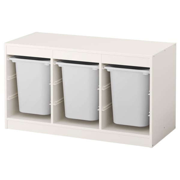Unidade de almacenamento branca IKEA TROFAST con tres colectores de plástico extraíbles, ideal para organizar xoguetes infantís.