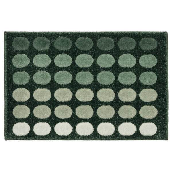 Alfombra TUNNELBANA verde escuro con patranza de gradiente circular, feita en polipropileno, rectangular e texturizada.