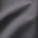 Tecido gris suave, texturizado, de dous tons en primeiro plano. Mostra unha calidade duradeira e tecida.