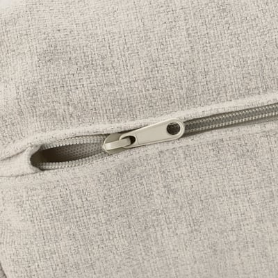 Primeiro plano da cremalleira no sofá tapizado branco de alta calidade, mostrando tecido duradeiro e detalle de cremalleira.