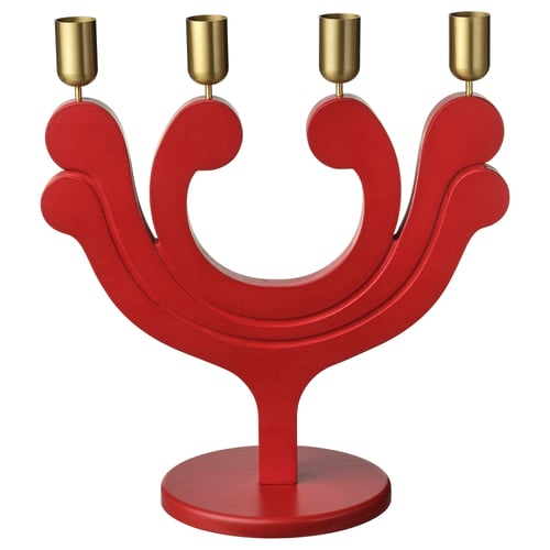 Portacandeas vermello VINTERFINT con catro velas de ouro, de forma xeométrica.