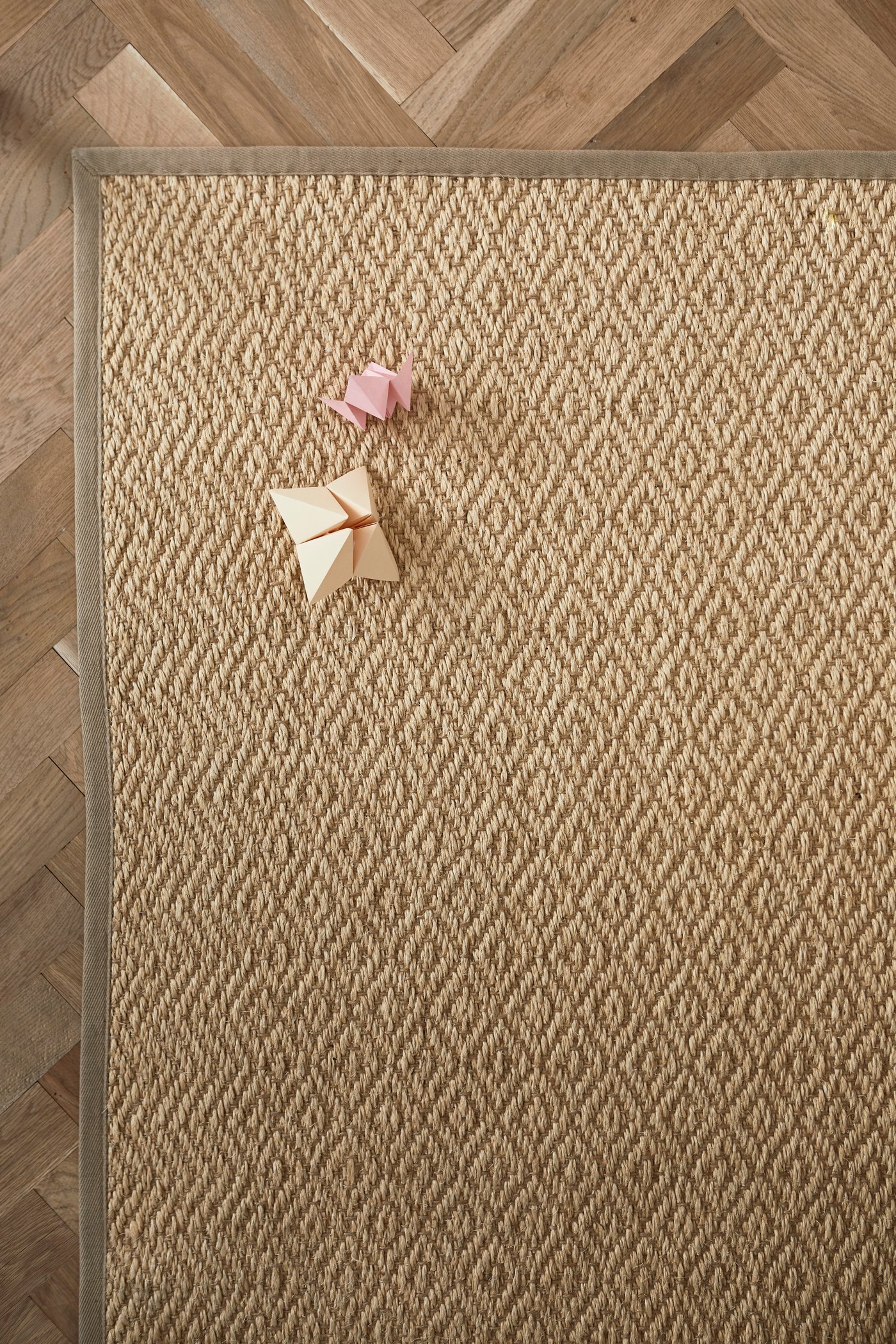 A flatwowen natural VISTOFT rug lays on a floor.