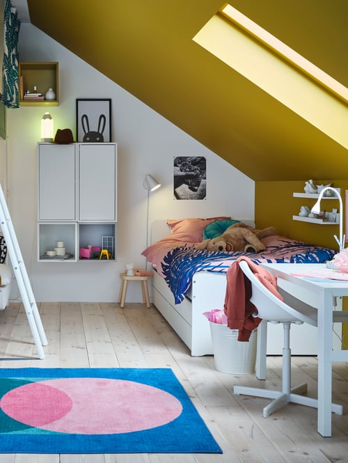 Children's bed frame with under bed, drawers, quilt cover and pillowcase, desk, child’s stool, rug, bin, cabinet, soft toy.