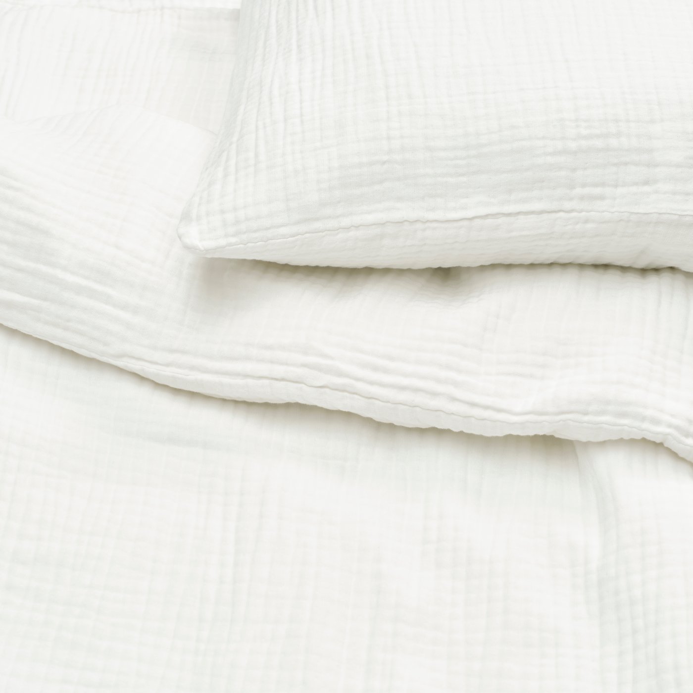 A white SCHERSMIN duvet cover and pillowcase