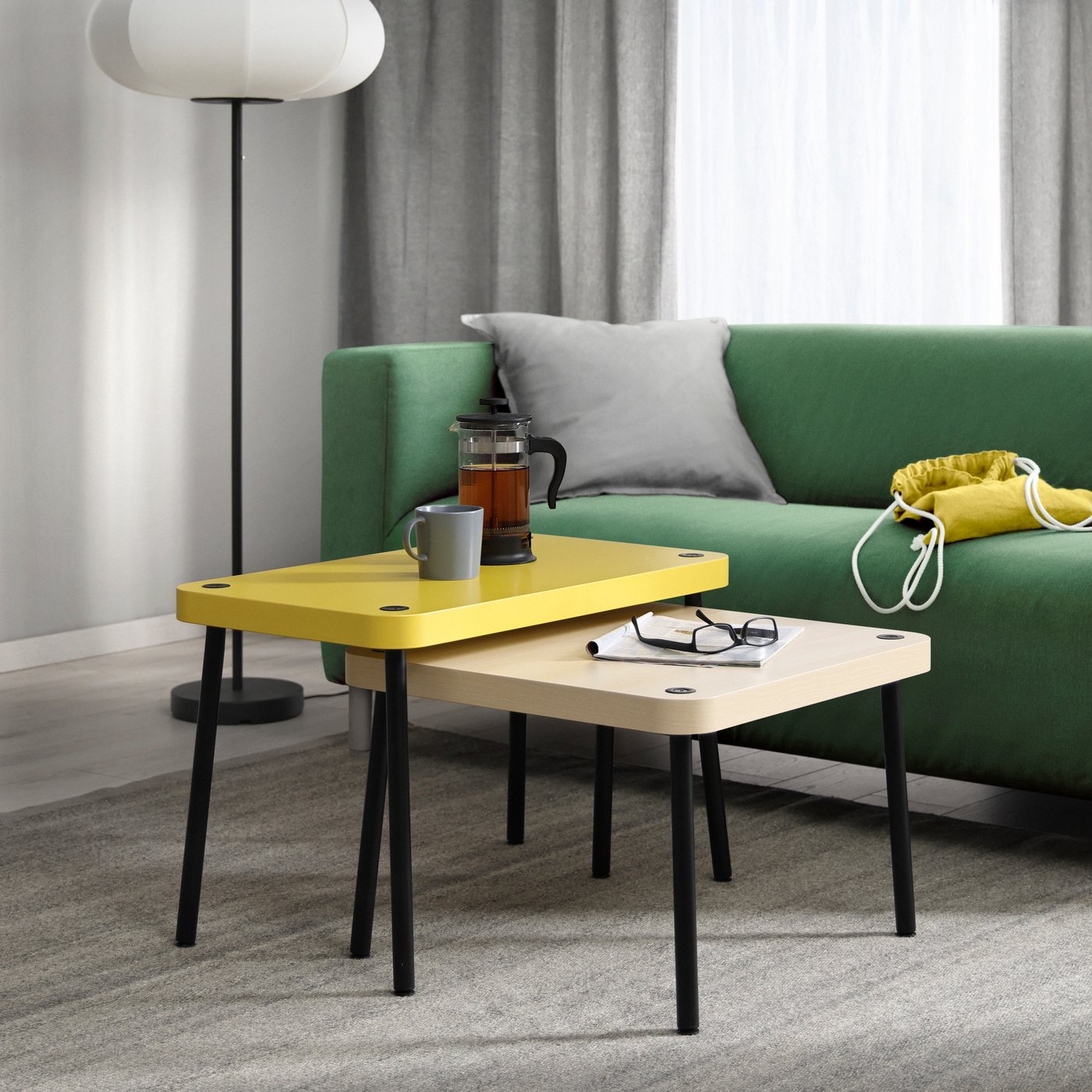 An yellow/birch effect SONHULT nest of tables