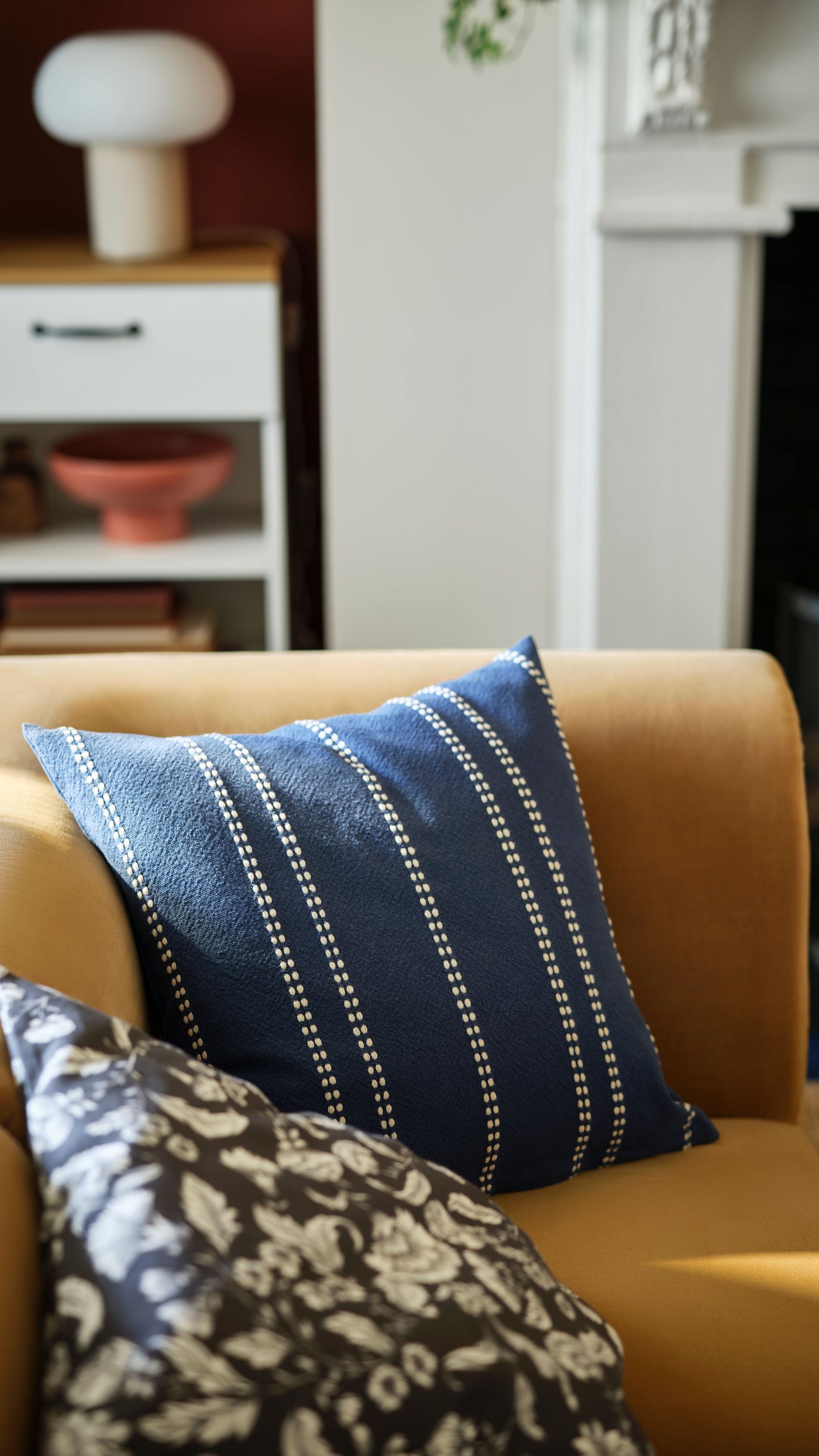 A red-brown BLOMVECKLARE serving bowl