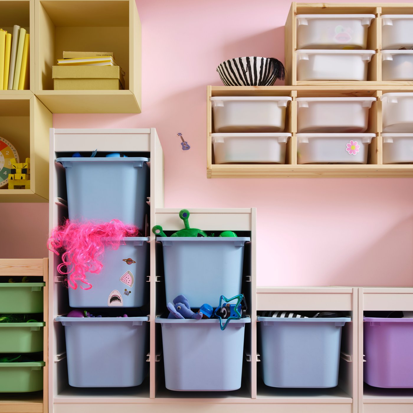 A light white stained pine TROFAST wall storage in the childrens room