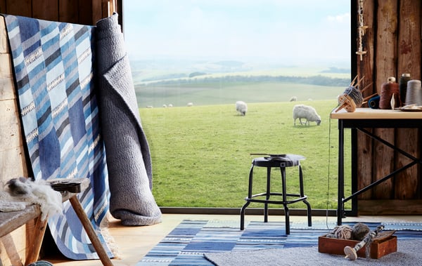 A handmade assorted blue shades TRANGET rug, flatwoven.