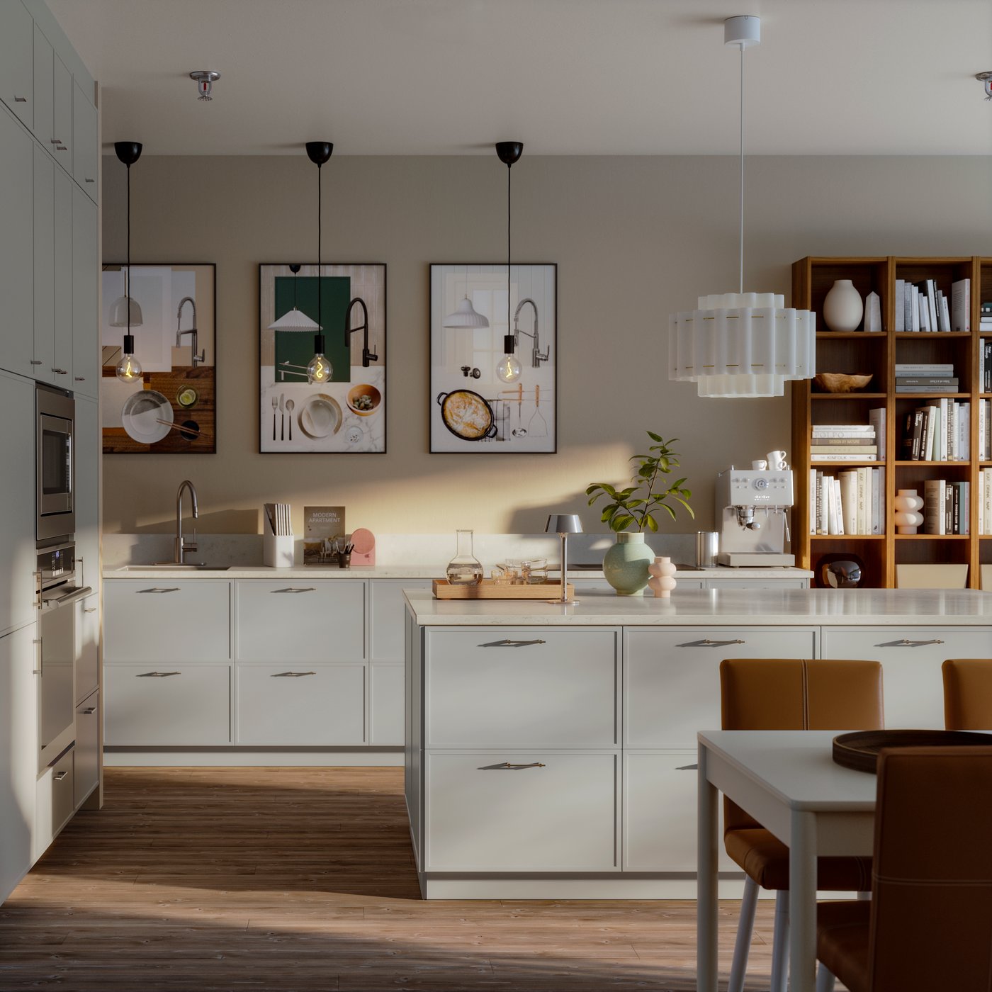A model kitchen with light grey cabinets and built-in appliances. We see a central island, and part of a dining table.