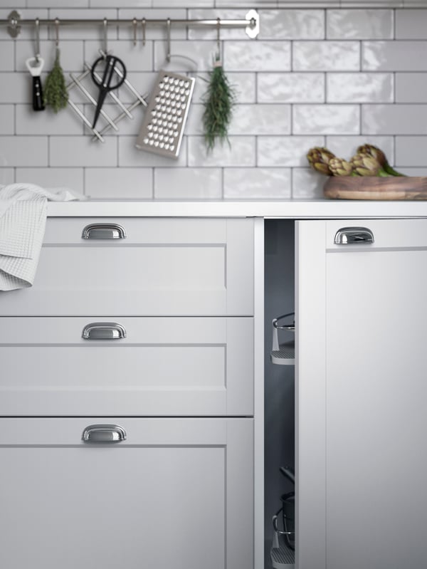 Close up of light grey shaker LERHYTTAN kitchen fronts with sliver cup handles