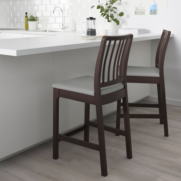 A dark brown/Orrsta light grey EKEDALEN bar stool with backrest