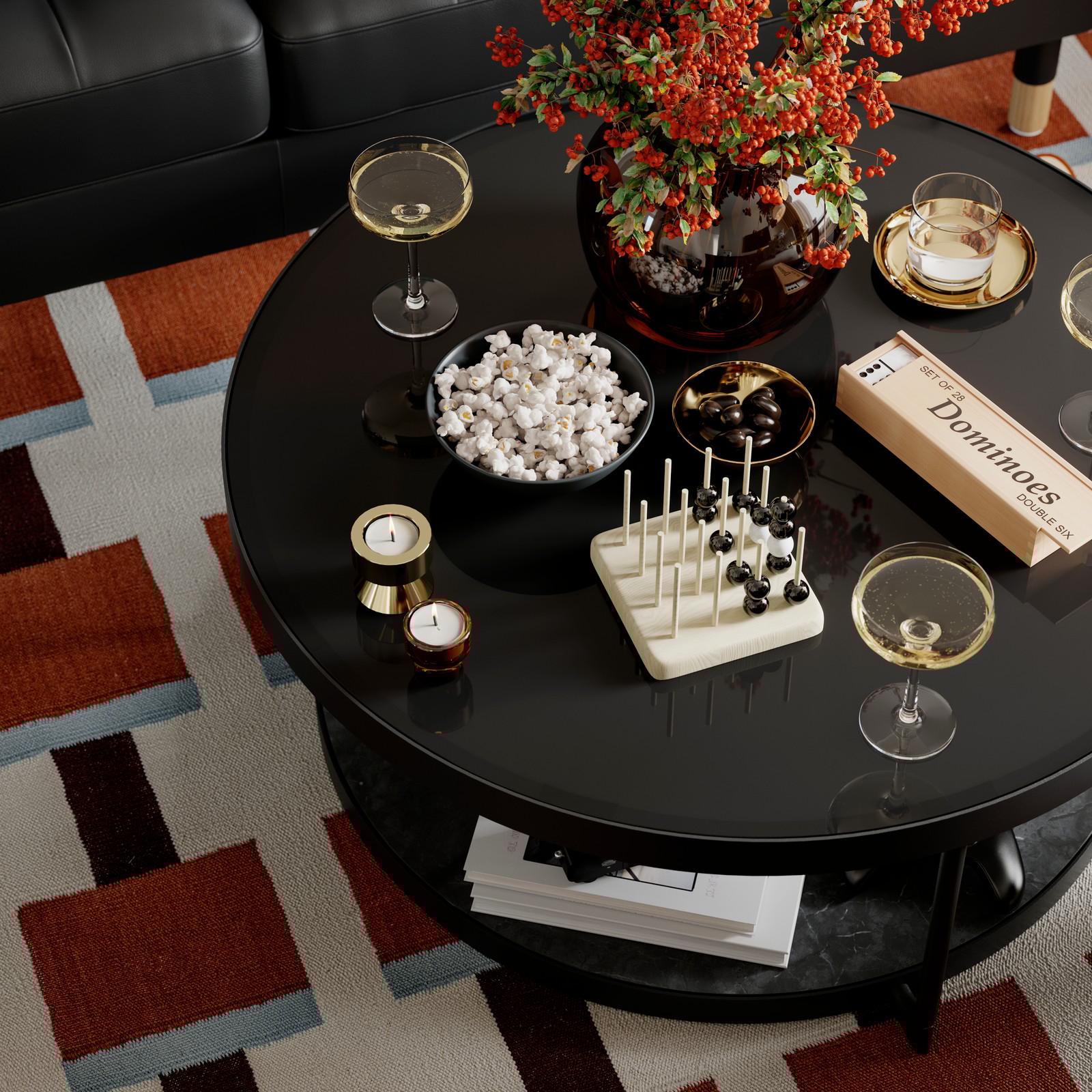 A FRÖTORP coffee table with popcorn, glasses and other things on top of it stands on a STOCKHOLM 2025 rug.