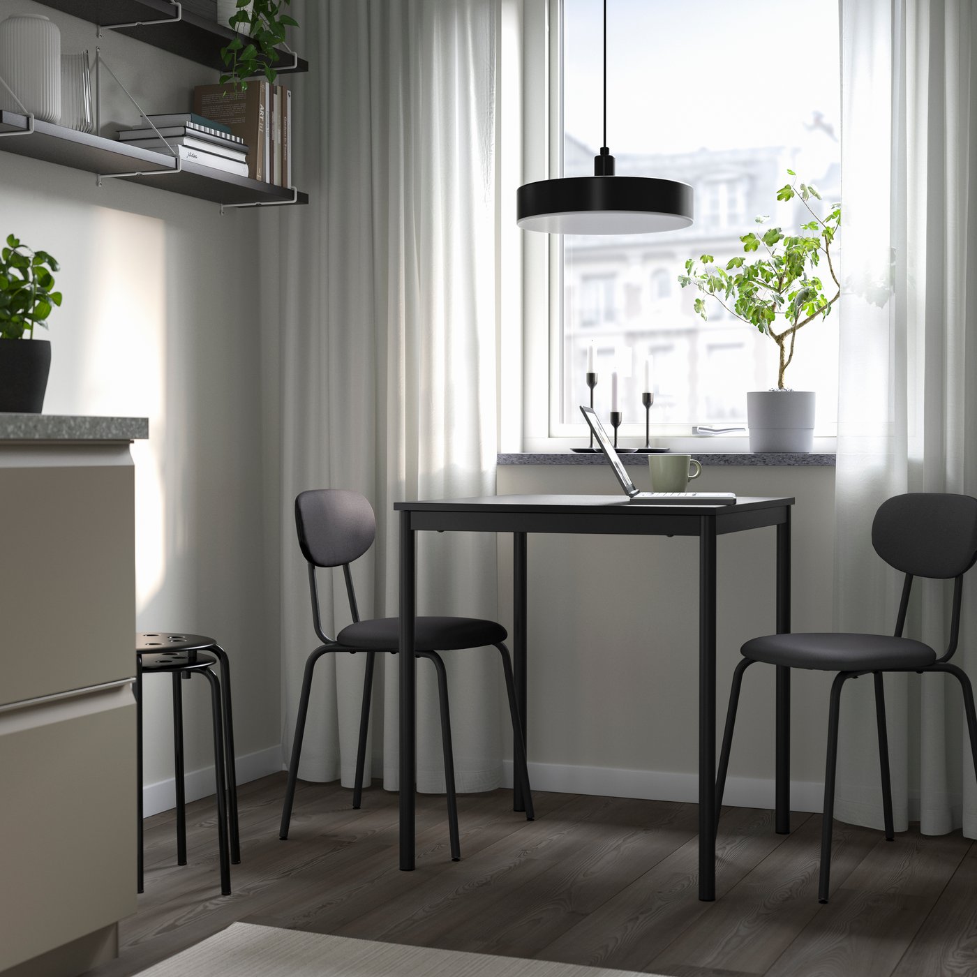A black black/Remmarn dark grey ÖSTANÖ table and 2 chairs