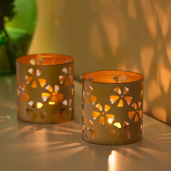 A gold-colour AROMATISK tealight holder