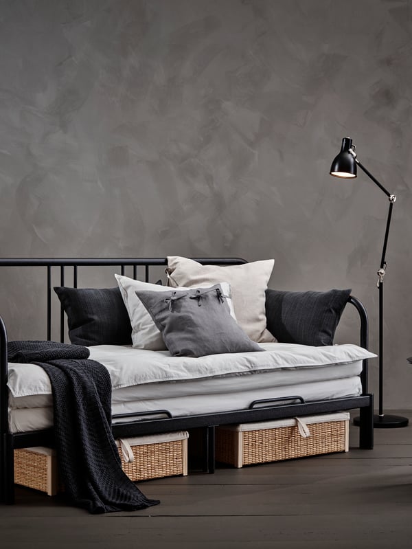 An anthracite ARÖD floor/reading lamp in the bedroom