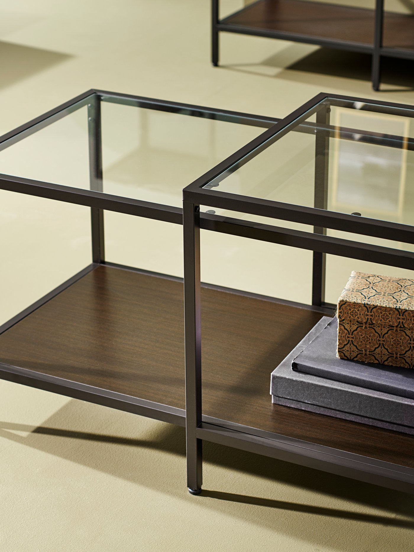 A black-brown/glass VITTSJÖ nest of tables