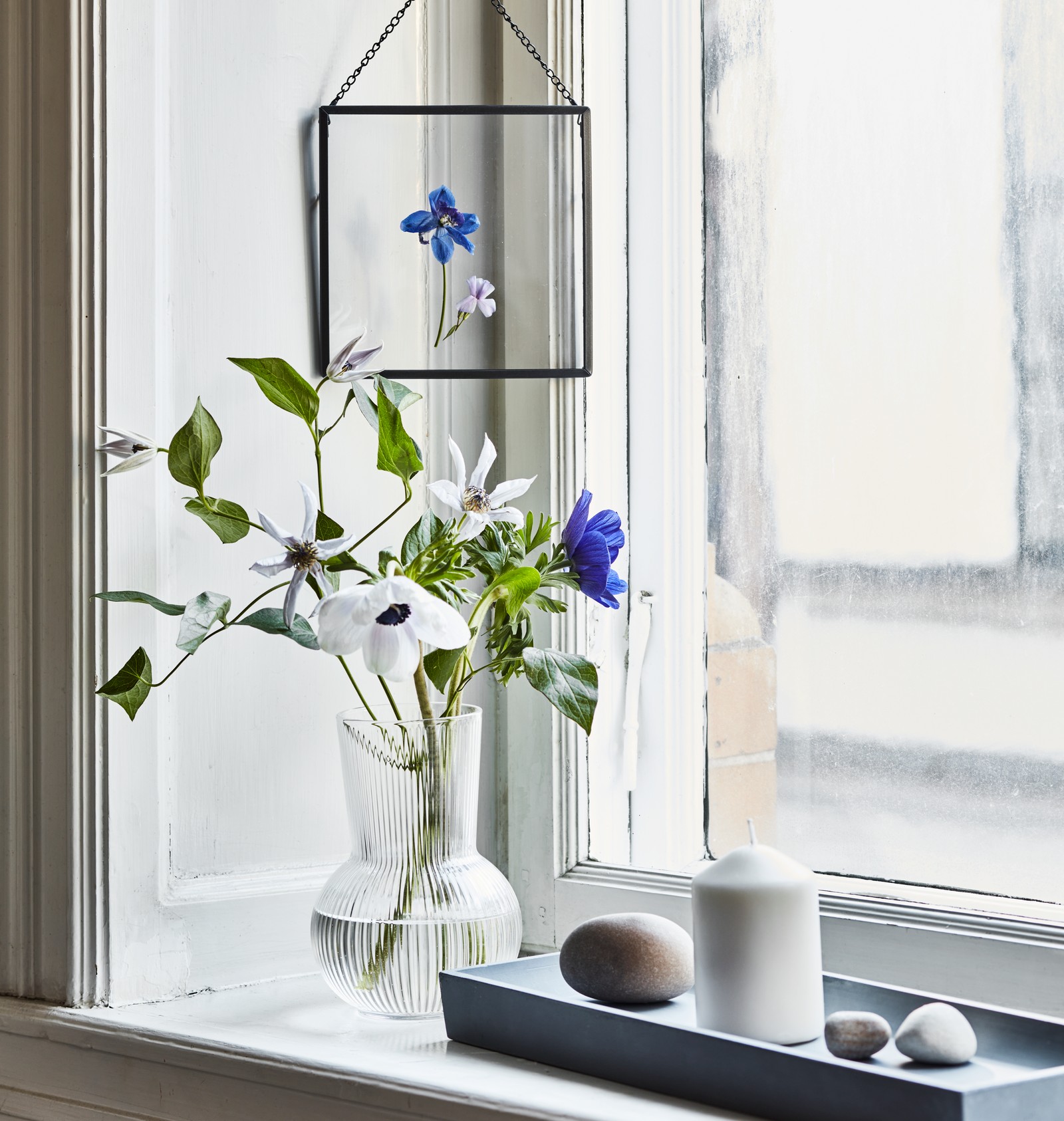 A grey BEGÄRAN candle dish