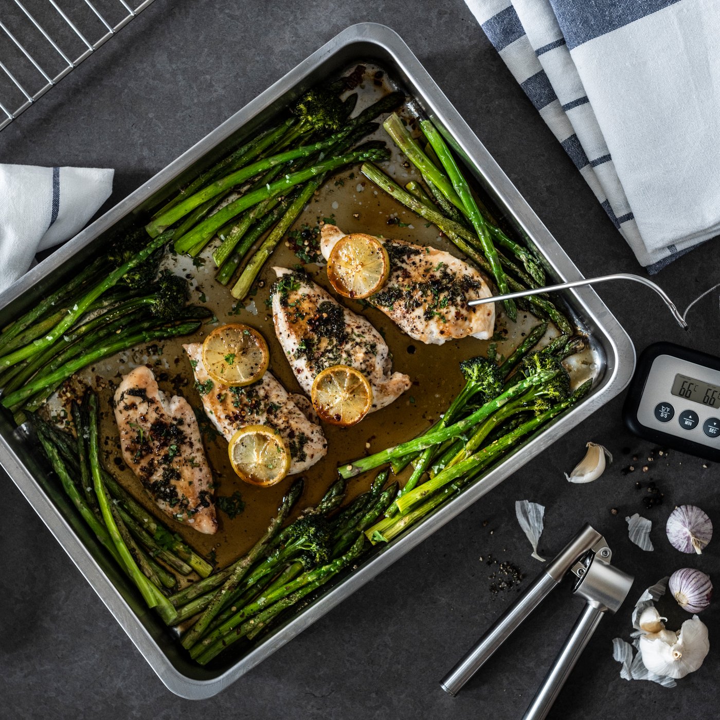 A stainless steel KONCIS garlic press in the kitchen