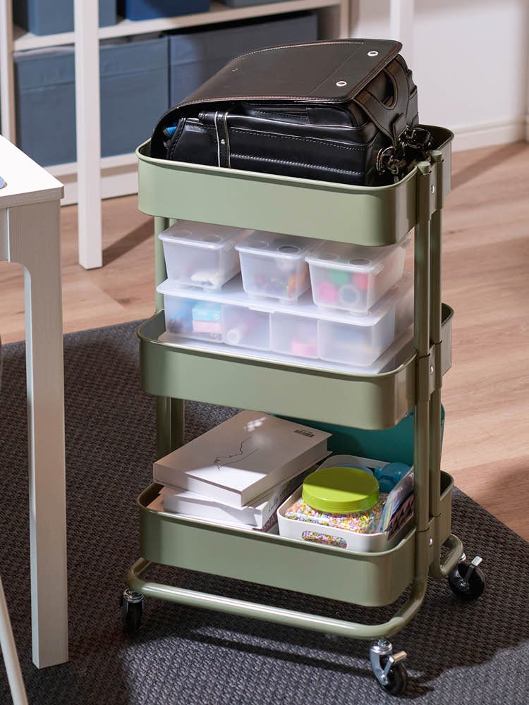 A grey-green RÅSKOG trolley