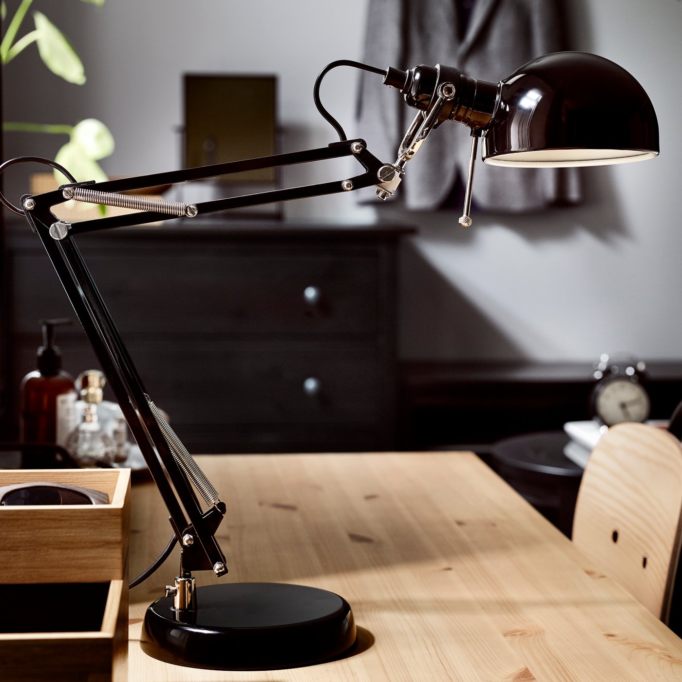 A black FORSÅ work lamp