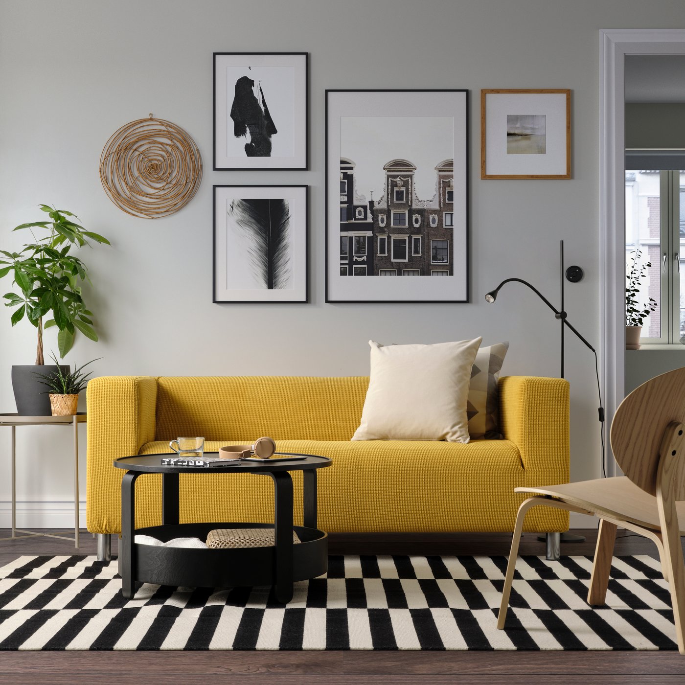 A Vansbro yellow KLIPPAN 2-seat sofa in the living room