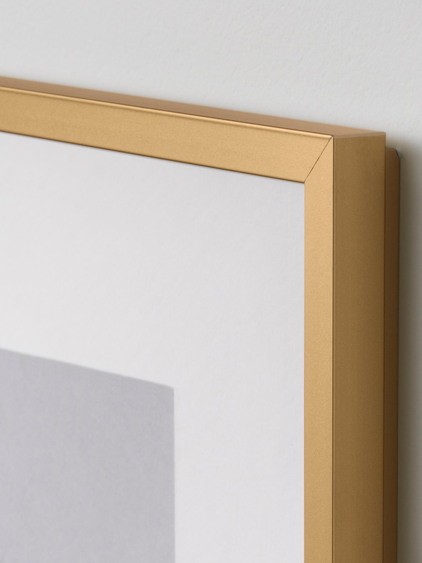 A gold-colour LOMVIKEN frame