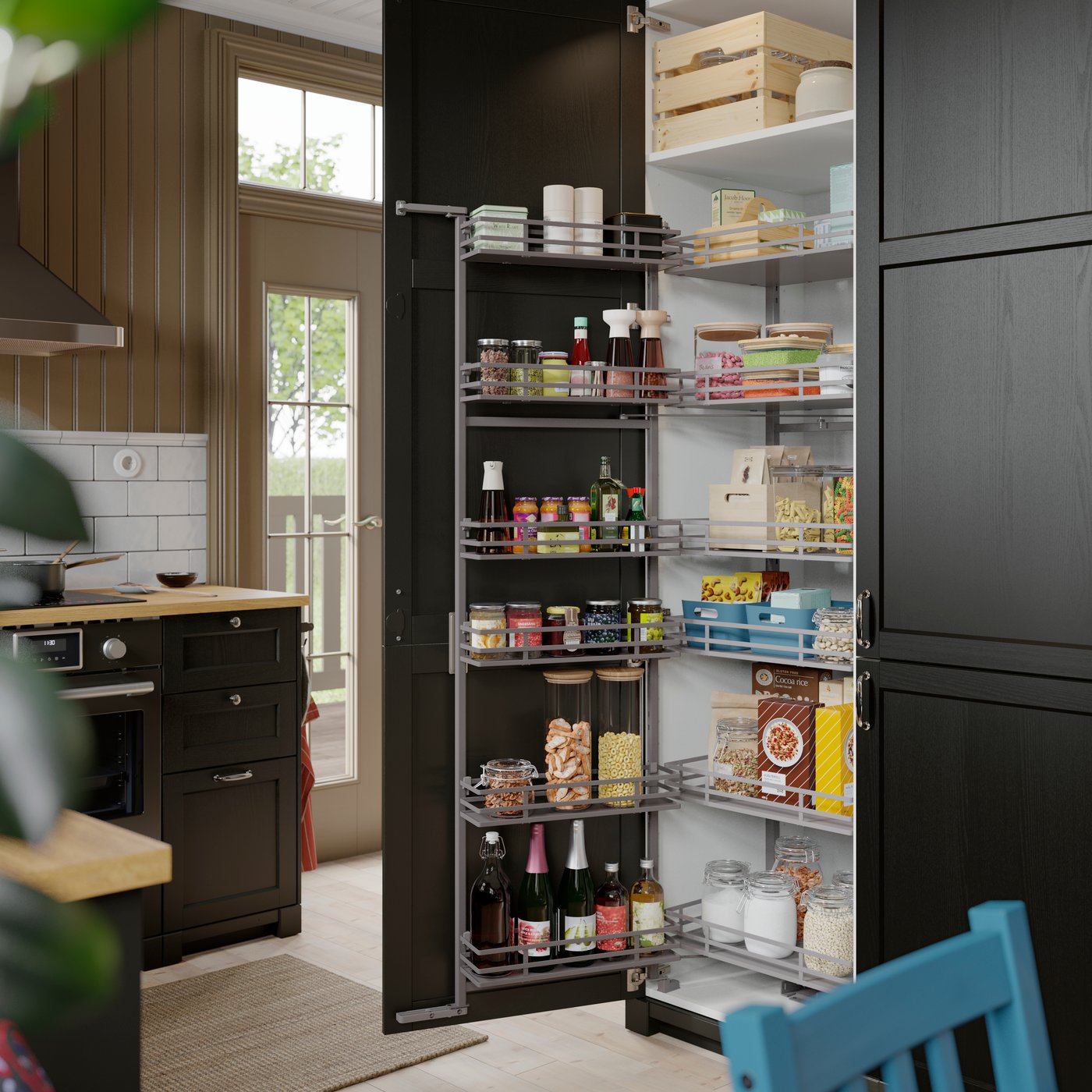 A kitchen featuring METOD high cabinet as a pantry with a pull-out larder filled with jars and condiments near the countertop.