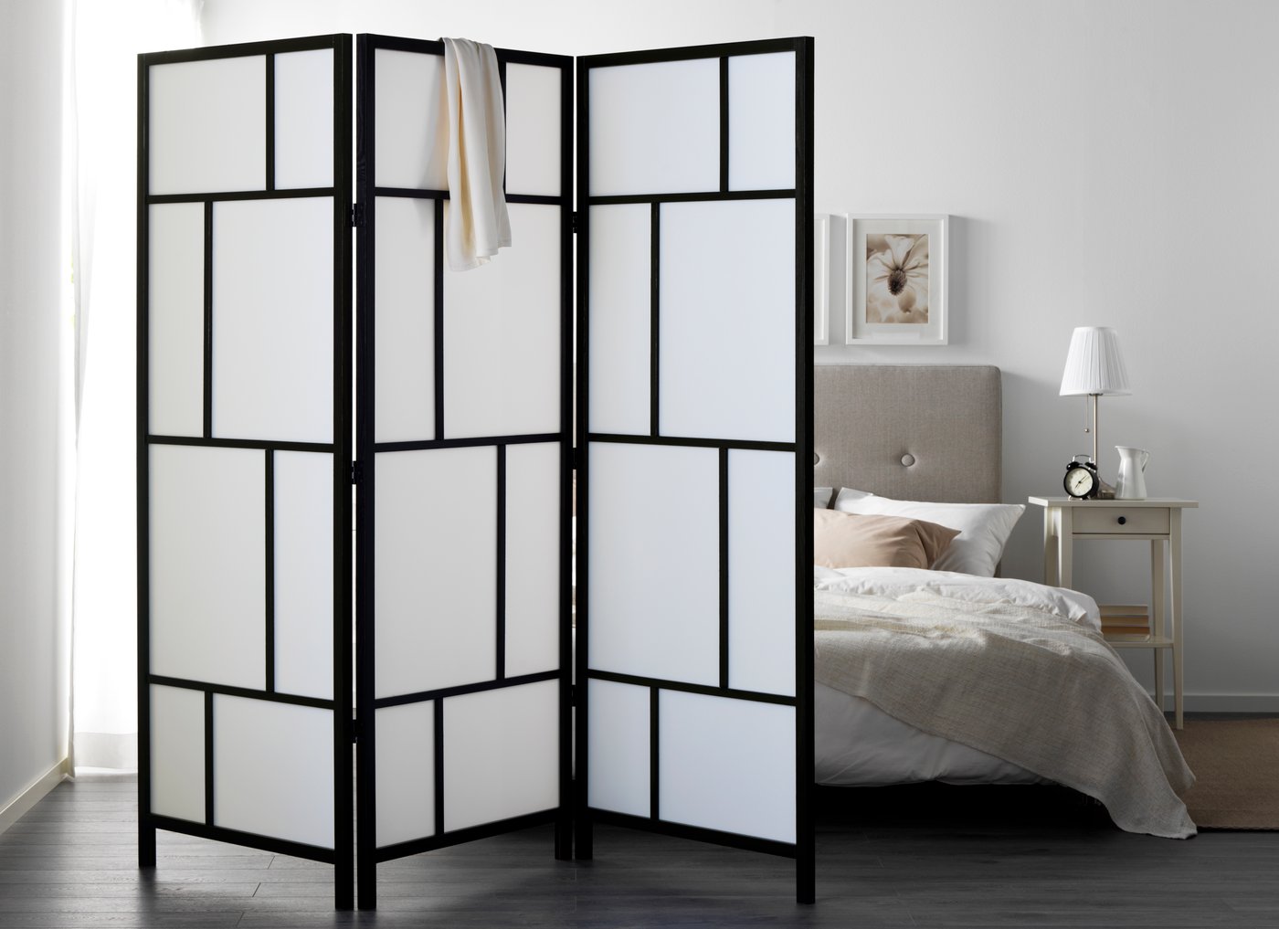 A white/black RISÖR room divider