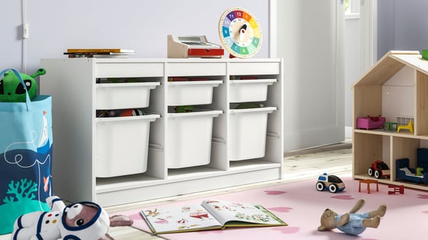 A white/white TROFAST storage combination with boxes