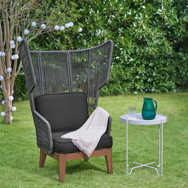 A grey VINGSÖN wing chair, in/outdoor