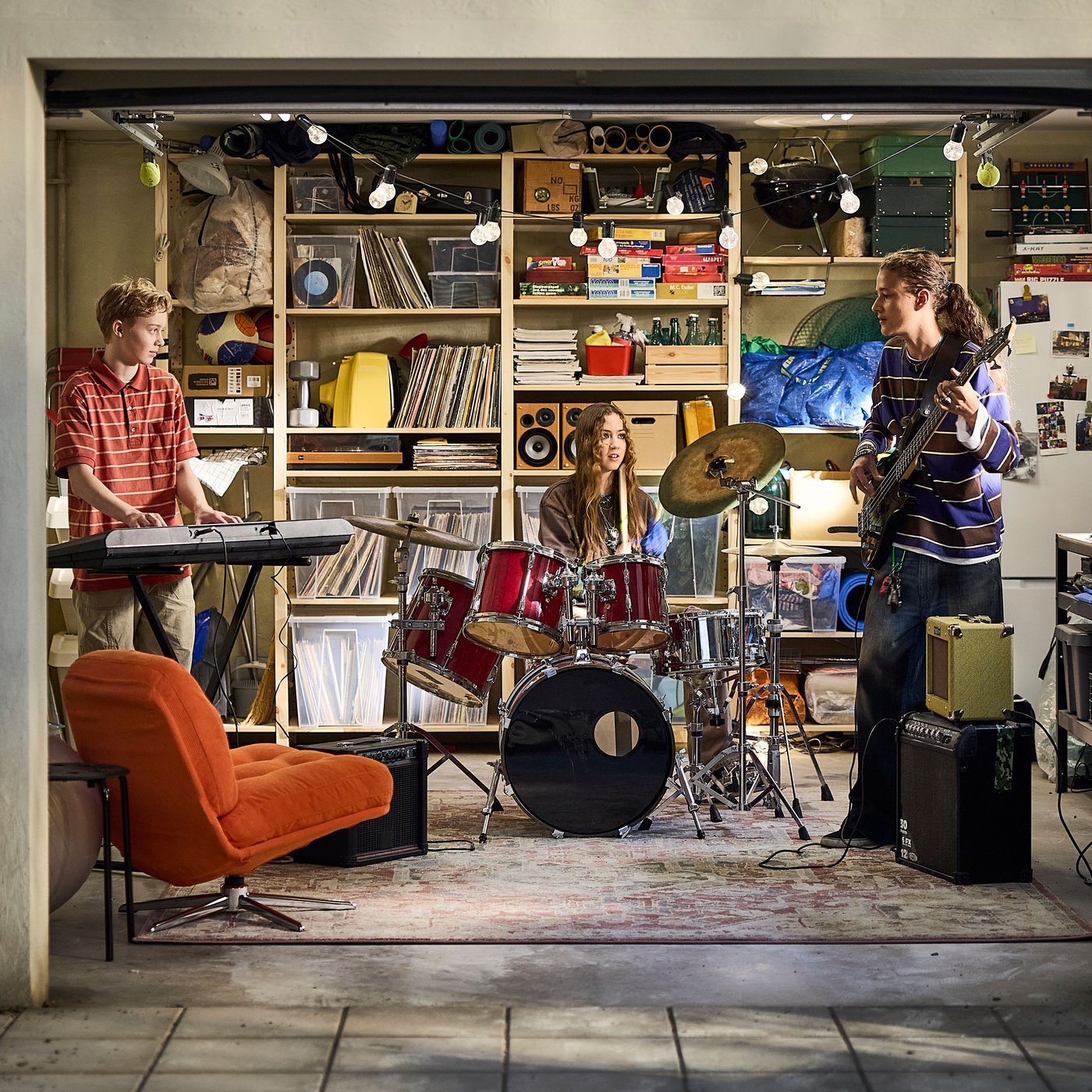 IVAR shelves and SAMLA boxes in an organised garage where a rock band is practising together.