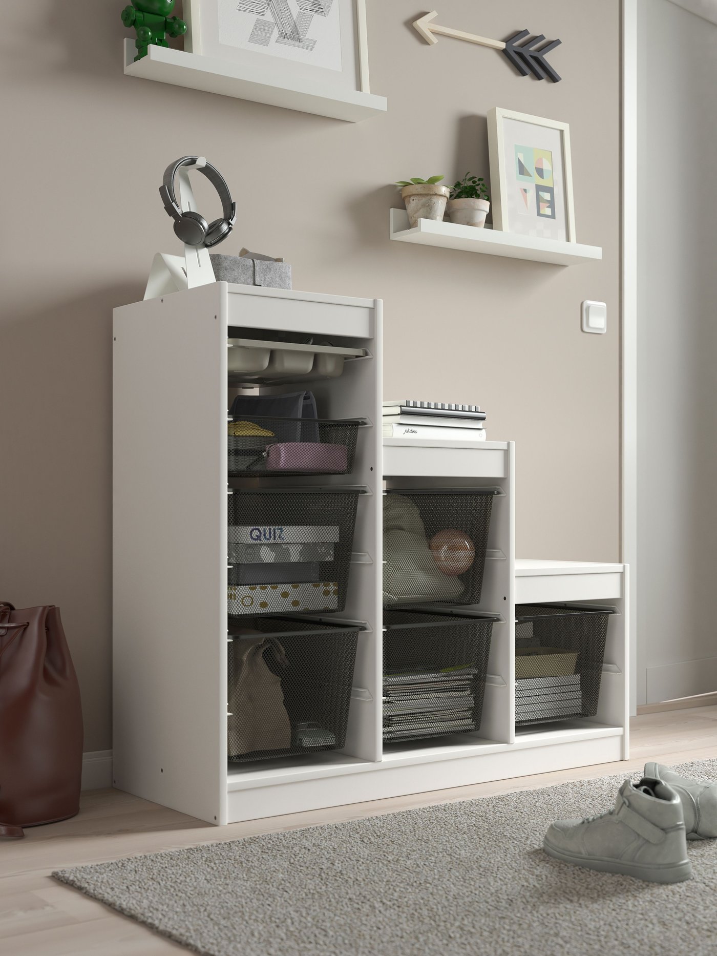 A white grey/dark grey TROFAST storage combination with boxes/tray