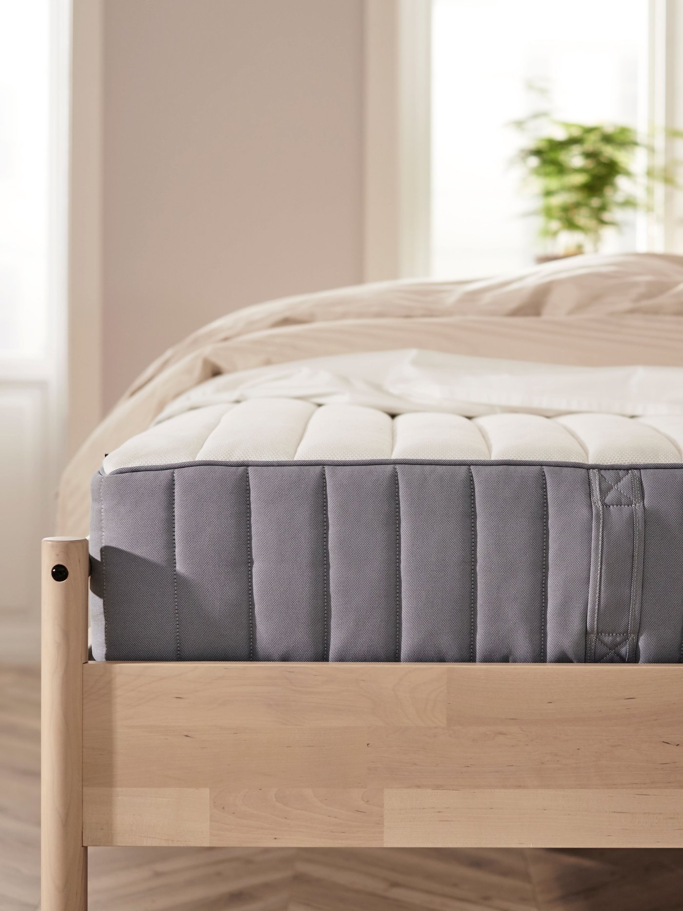 A firm/light blue VALEVÅG pocket sprung mattress
