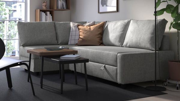 A grey/walnut effect SONHULT nest of tables