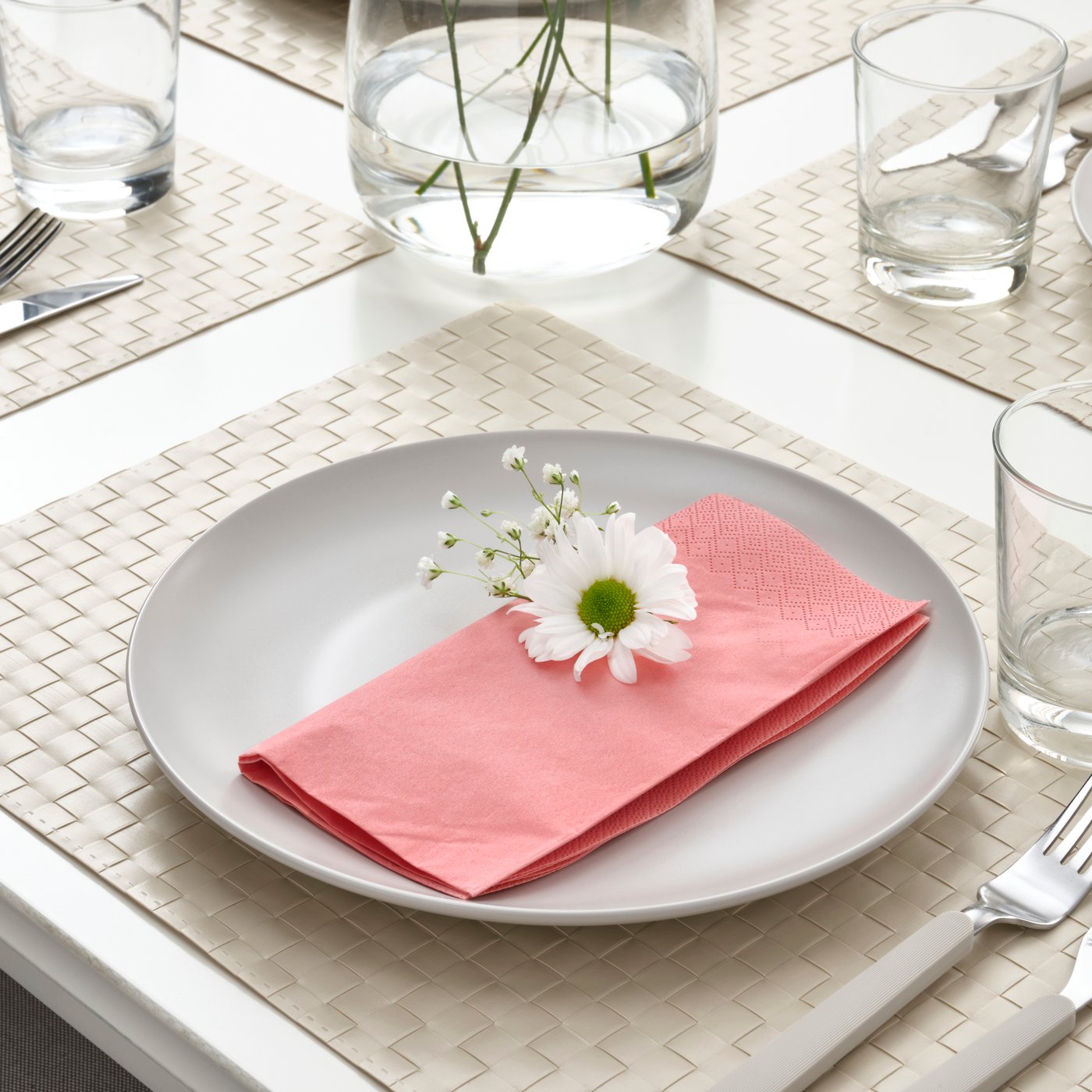 A light red-pink FANTASTISK paper napkin