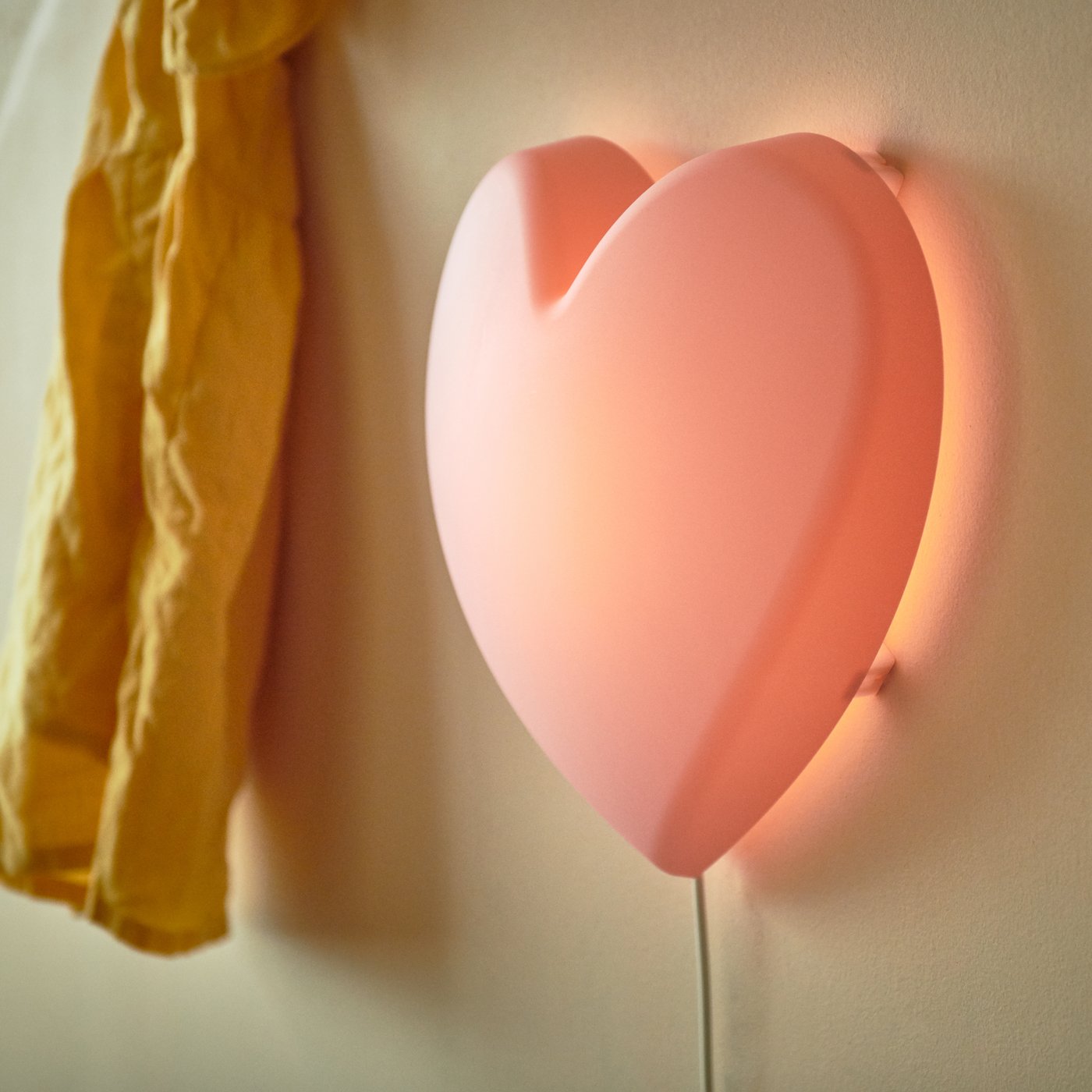 A heart pink UPPLYST LED wall lamp