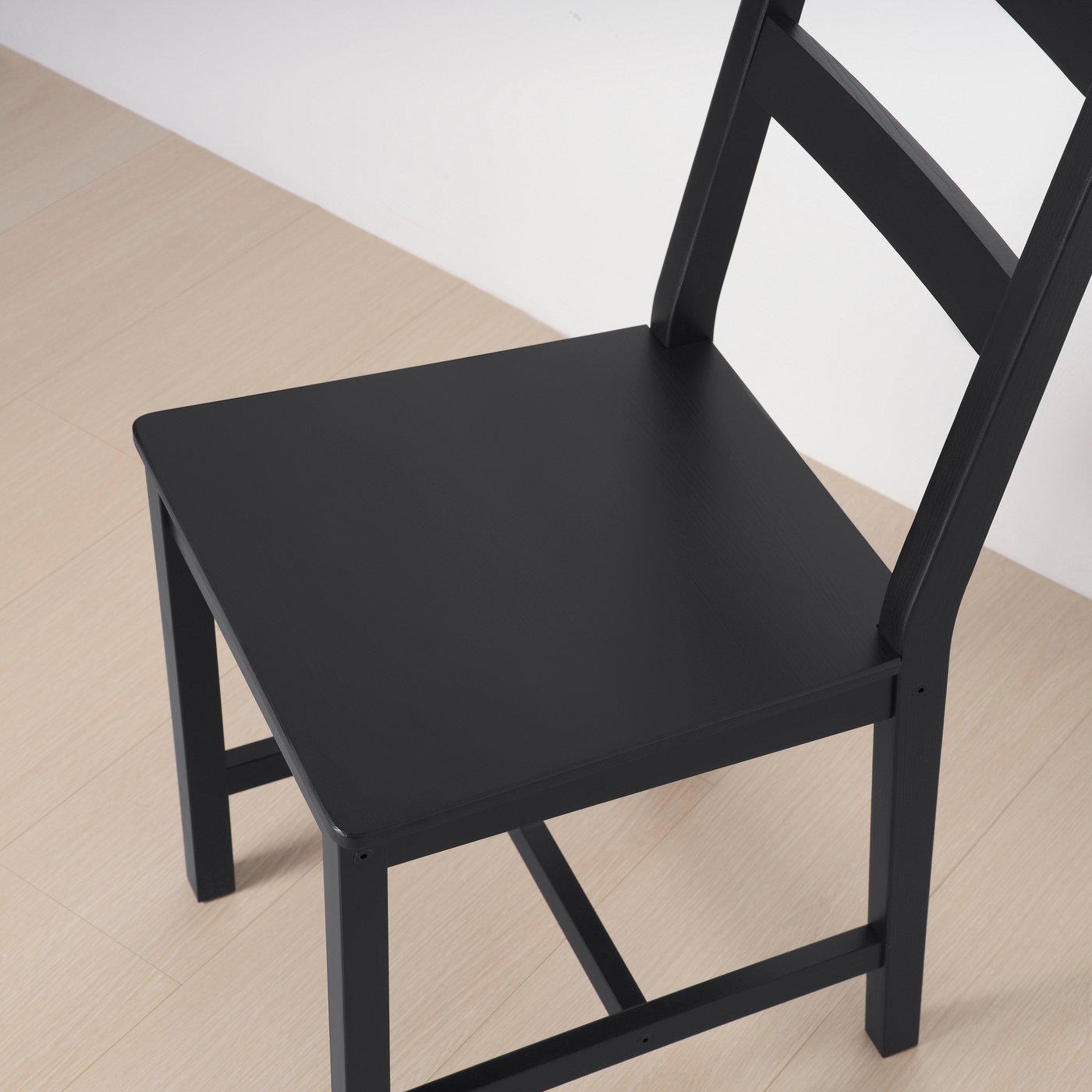 A black stained pine HÄGERNÄS chair