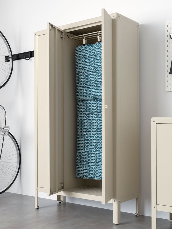 A beige KOLBJÖRN cabinet in/outdoor