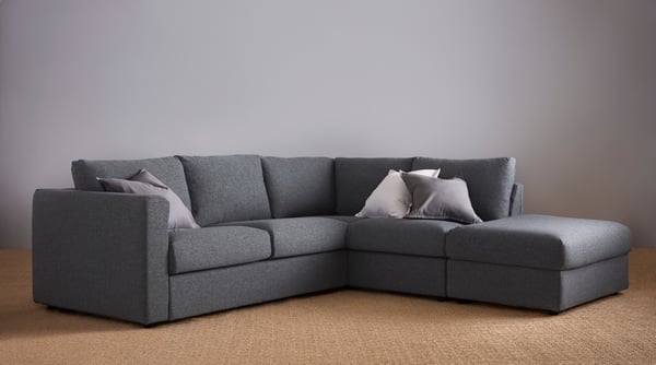 A grey VIMLE corner sofa with footstool section.