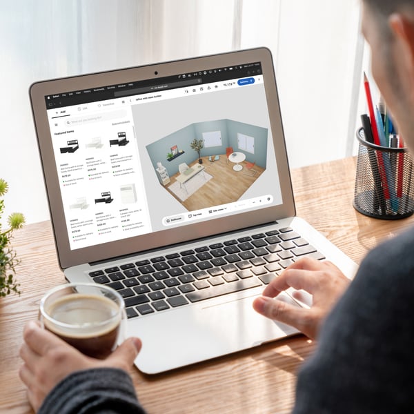 IKEA customer on their laptop using the IKEA Kreativ planner to design their room