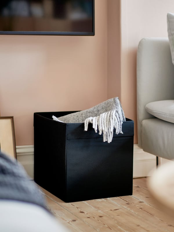 A black DRÖNA box in the living room.