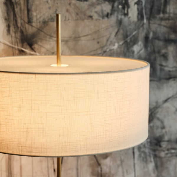 A white textile/brass-plated STOCKHOLM 2025 floor lamp