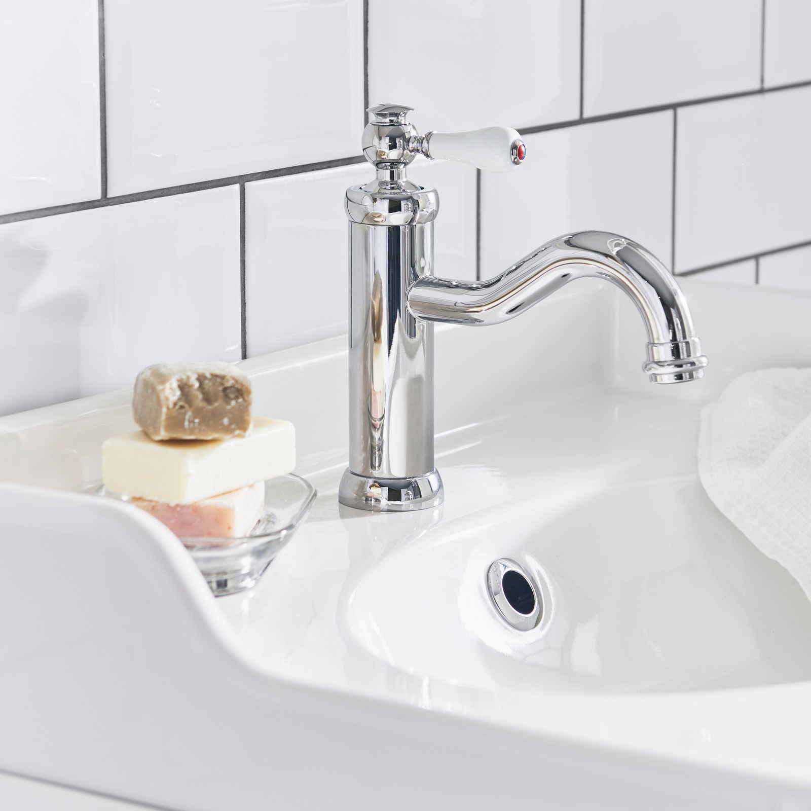 A chrome-plated HAMNSKÄR wash-basin mixer tap with strainer in the bathroom