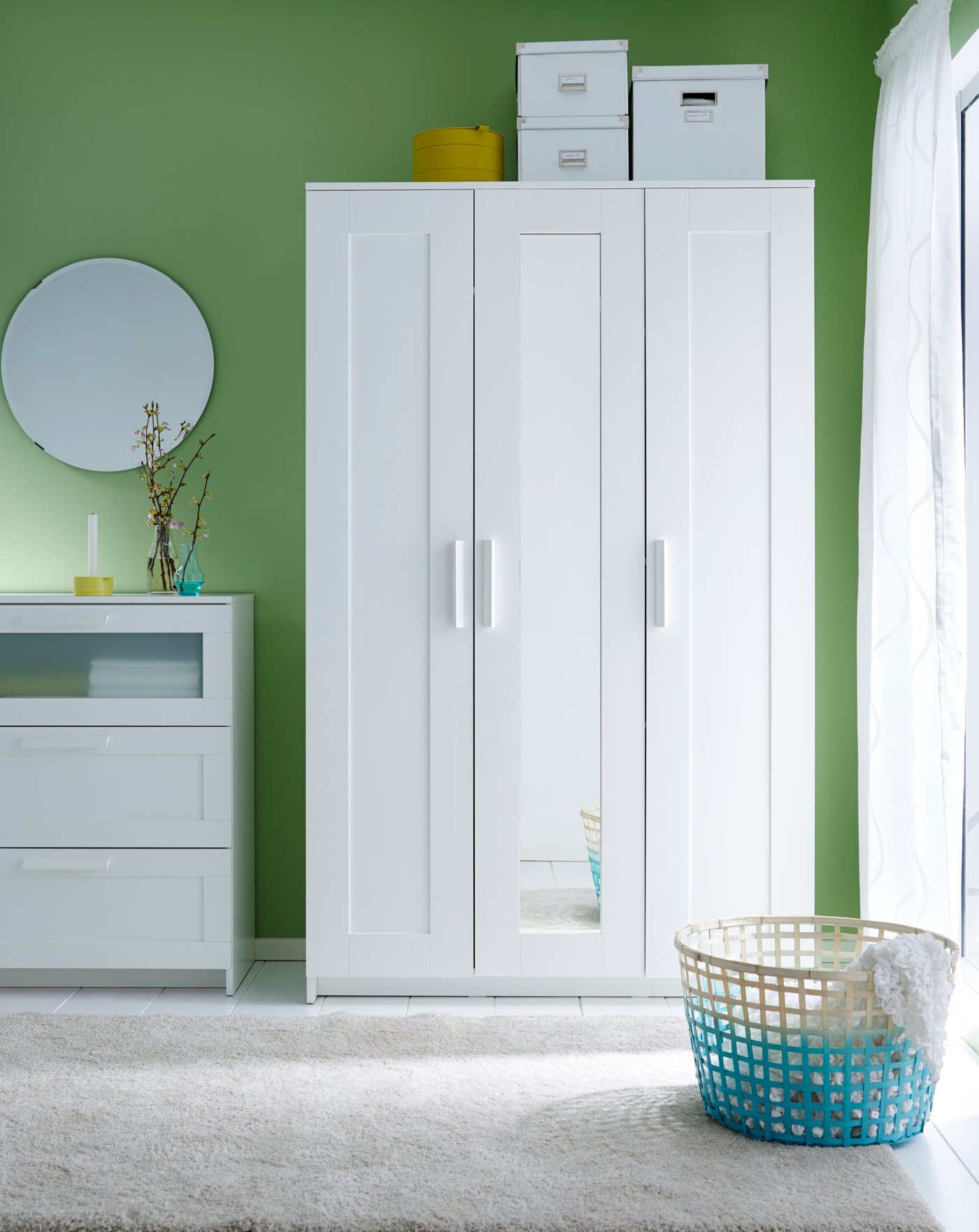 A black LINDBYN mirror in the bedroom