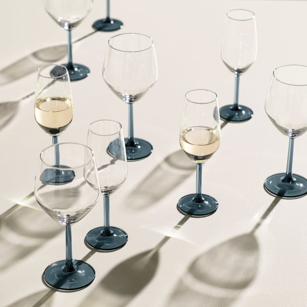 A blue-grey/clear glass RÖDRÄKA champagne glass