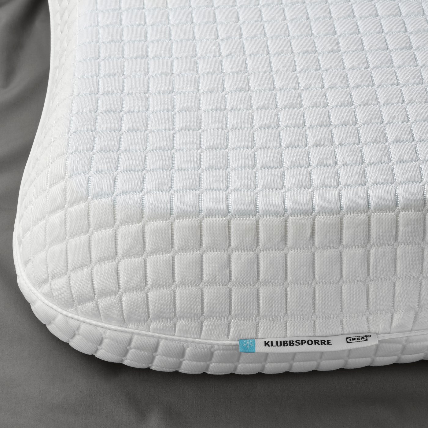 En ergonomisk KLUBBSPORRE kudde för sid-/ryggsovare.