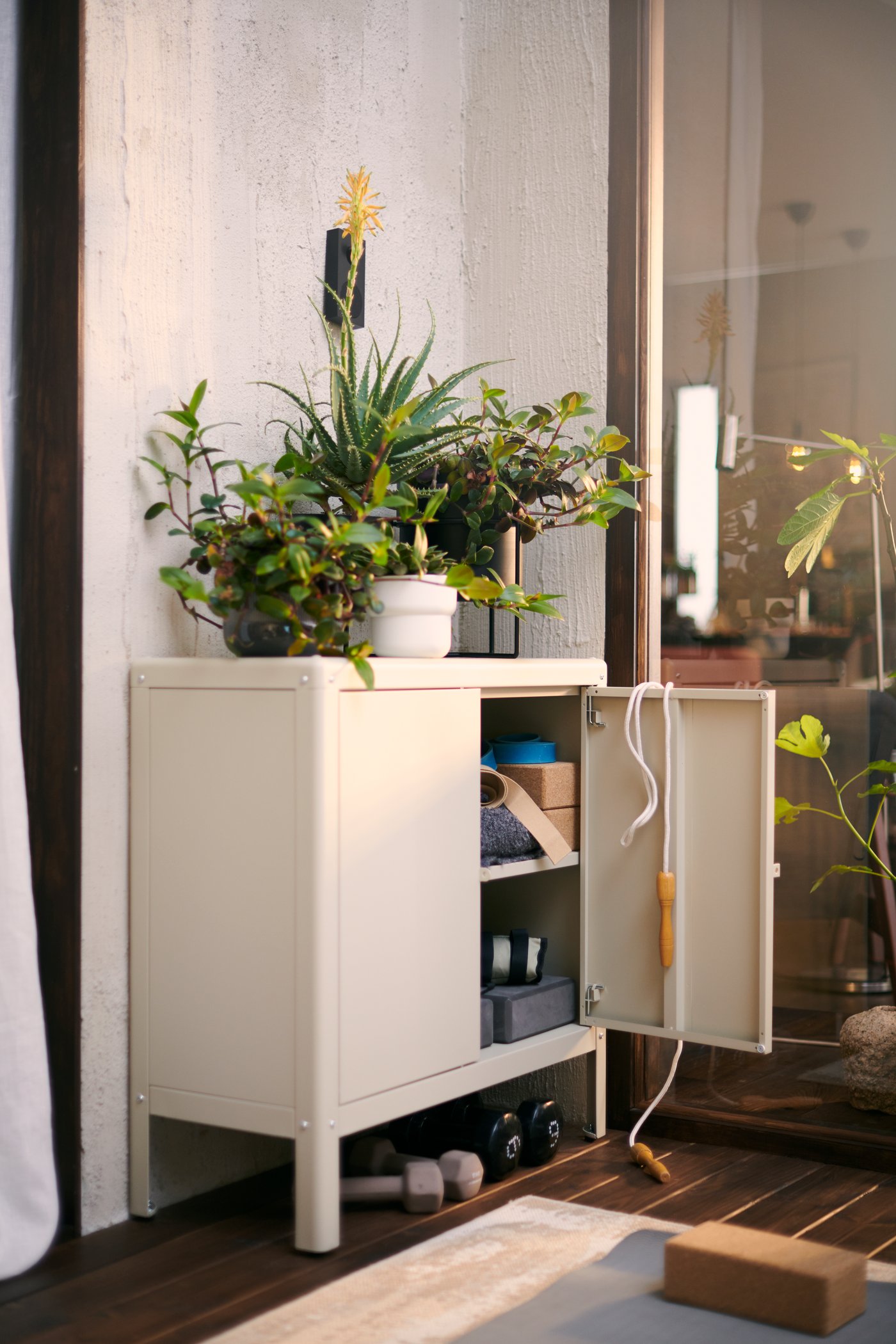 A beige KOLBJÖRN cabinet in/outdoor outside