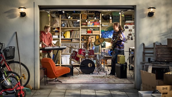 IVAR shelves and SAMLA boxes in an organised garage where a rock band is practising together.