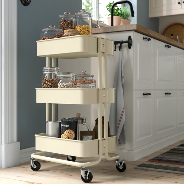 A beige RÅSKOG trolley