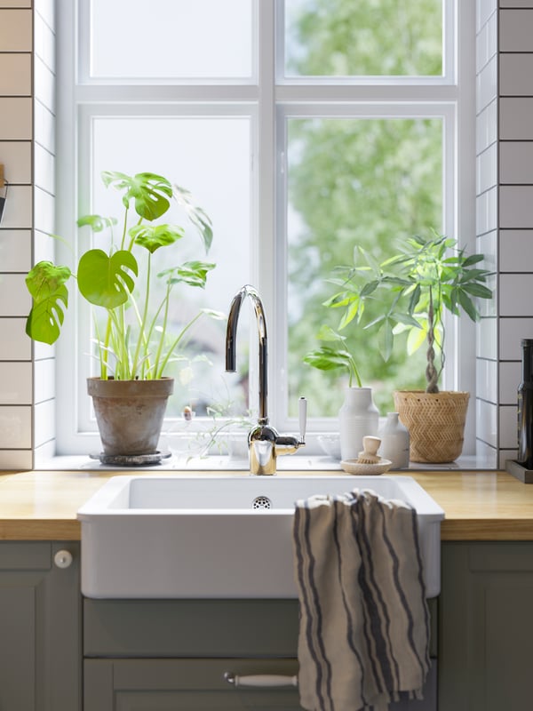 A handmade bamboo KLYNNON plant pot in the kitchen